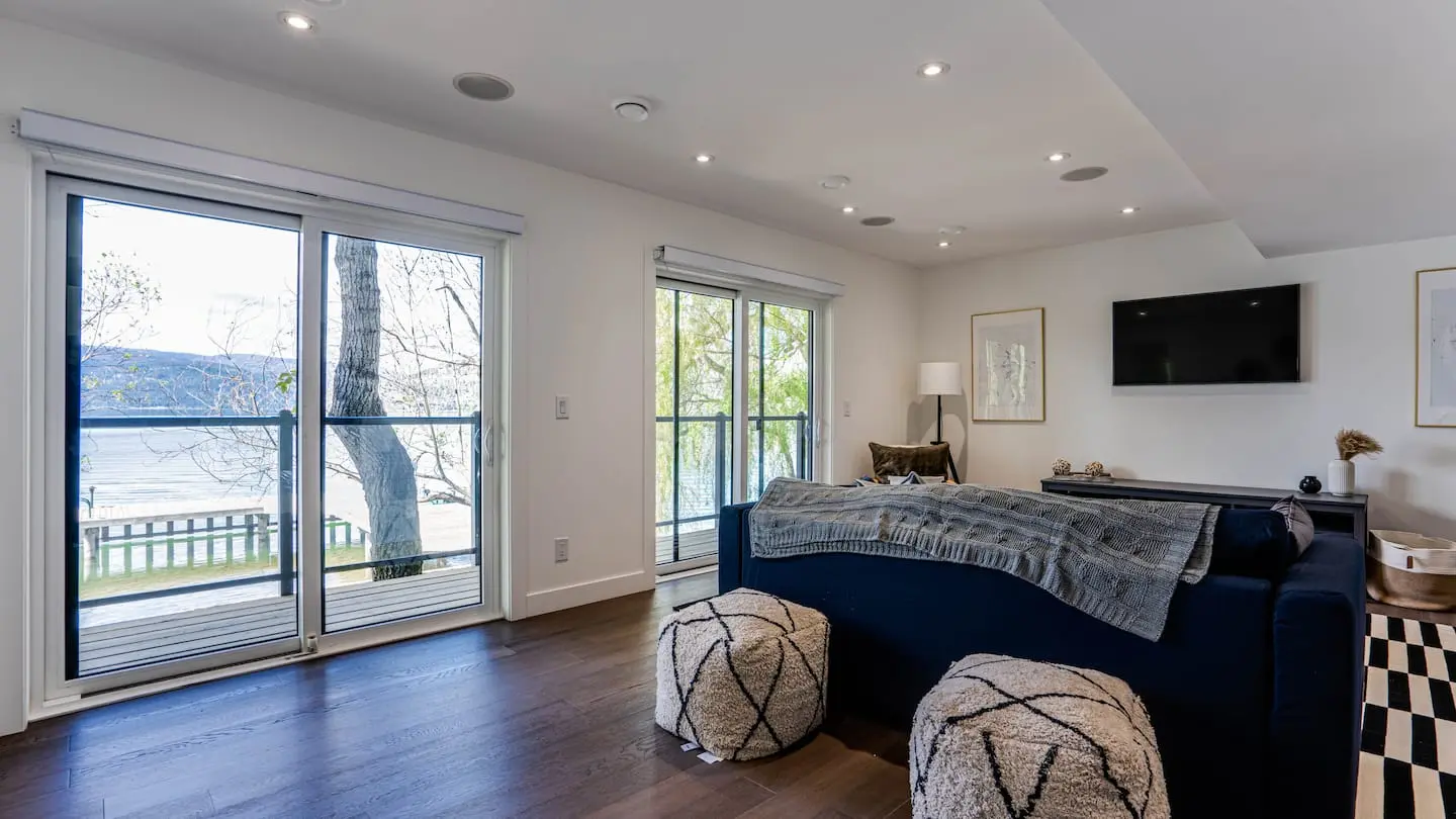 Bedroom 2 with sofa and lake-view sliding doors