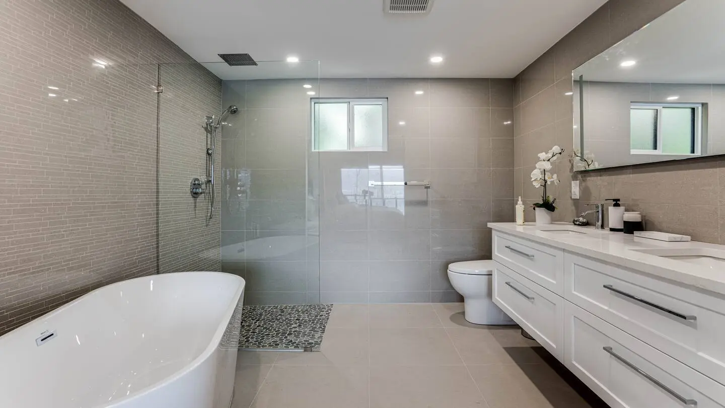 Bathroom with soaker tub, glass shower and double vanity