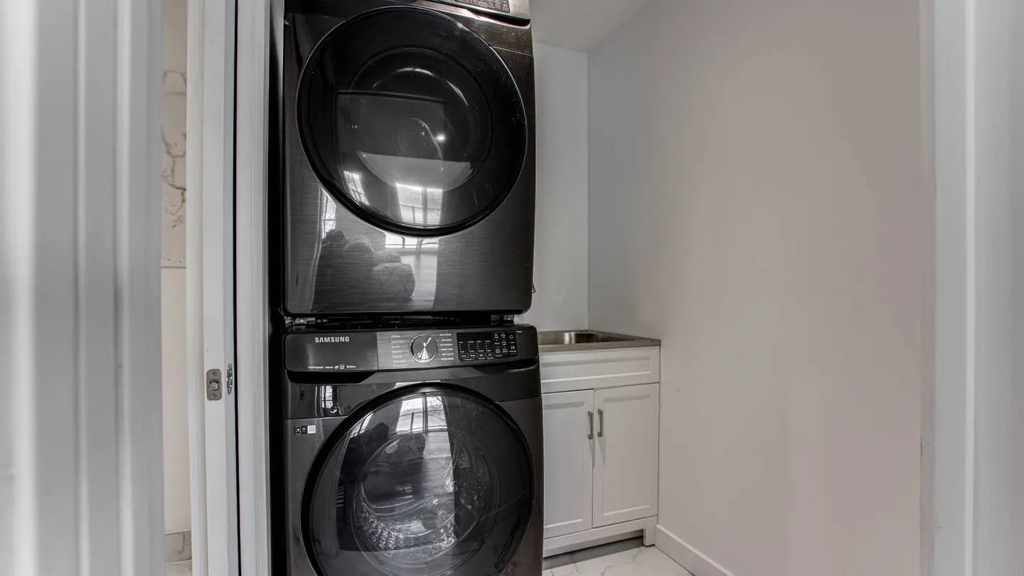 Laundry with stacked washer and dryer