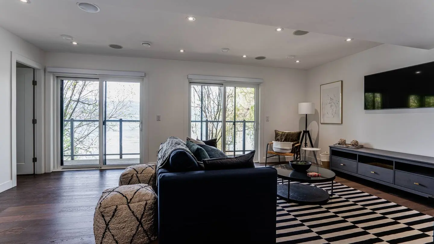Family room with sofa and wall-mounted TV